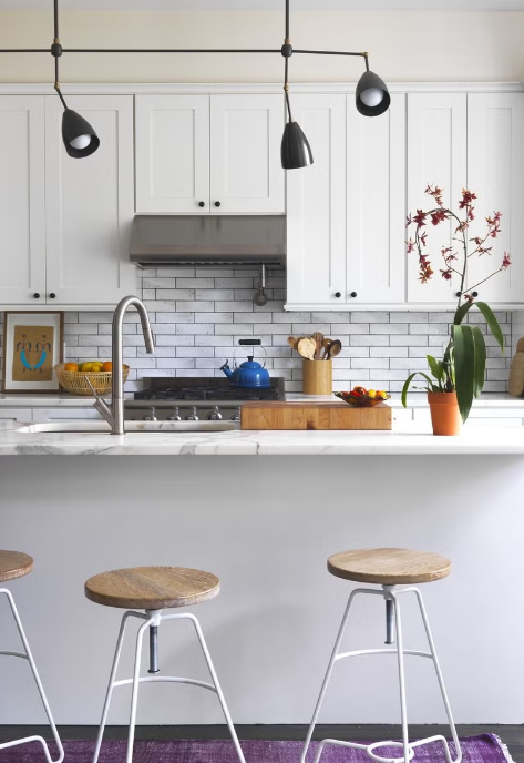 All White Kitchen With Vibrant Accents