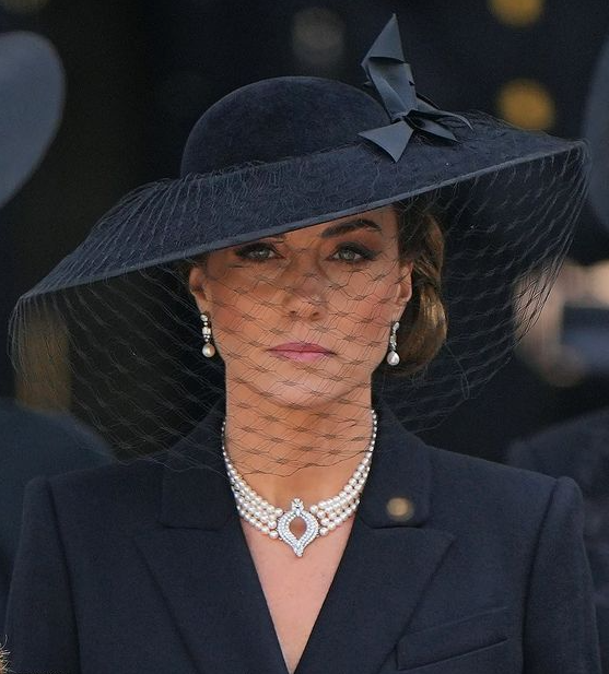 Kate Middleton Pictures - Duchess of Sussex wipes her eye as she and Harry watch Queen's funeral
