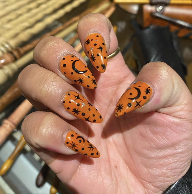 Celestial Halloween Nails With Orange And Black Patterns