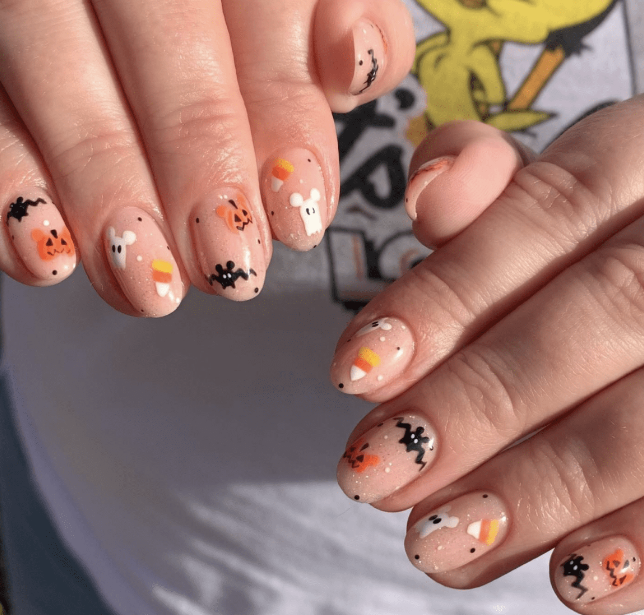 Cute Halloween Nails With Candy Corn And Ghosts