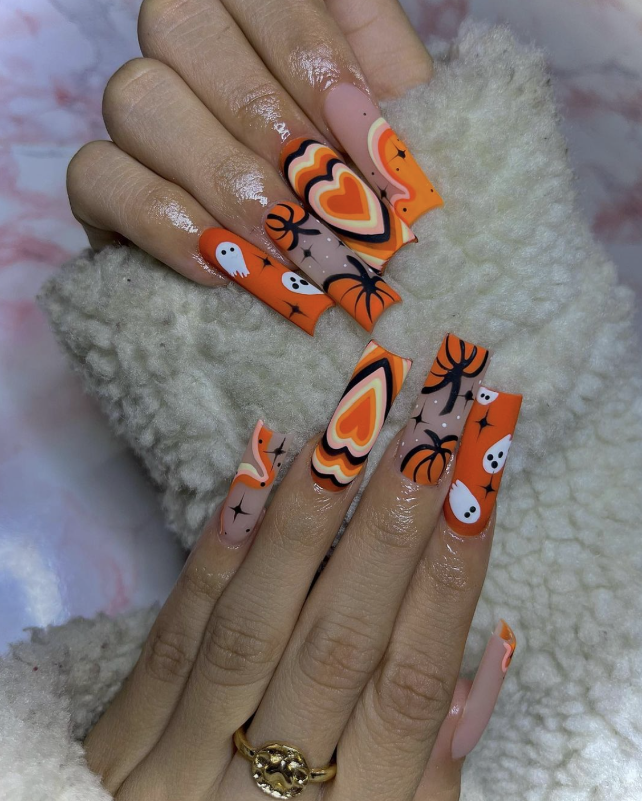 Groovy Halloween Nails With Ghosts And Heart Patterns