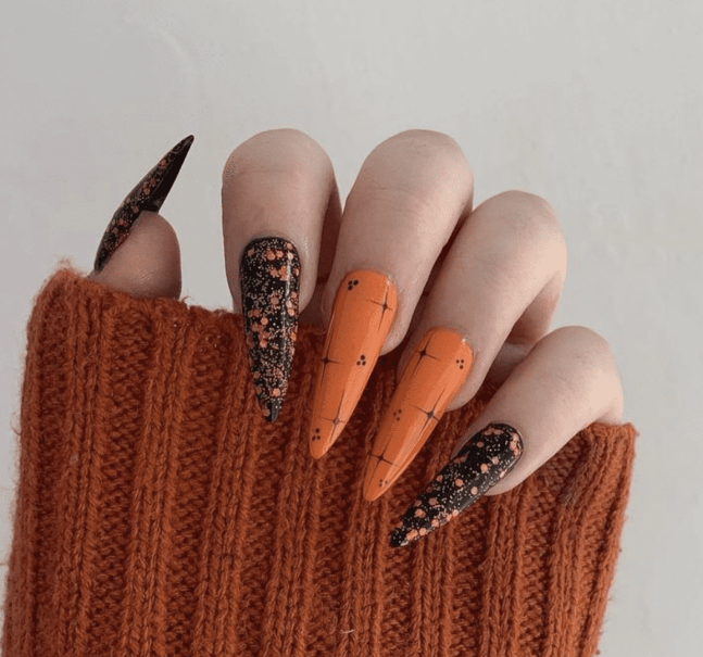 Halloween Nails With Splatter And Stitched Patterns