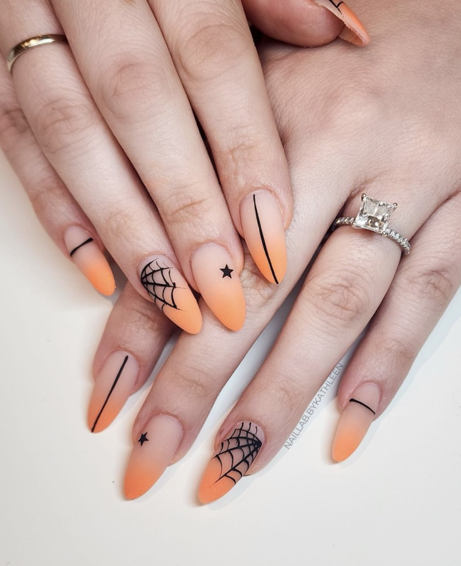 Minimalist Halloween Nails With Spider Webs And Stars