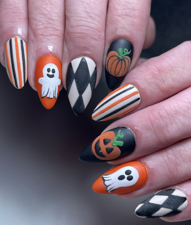 Playful Halloween Nails With Stripes And Ghosts