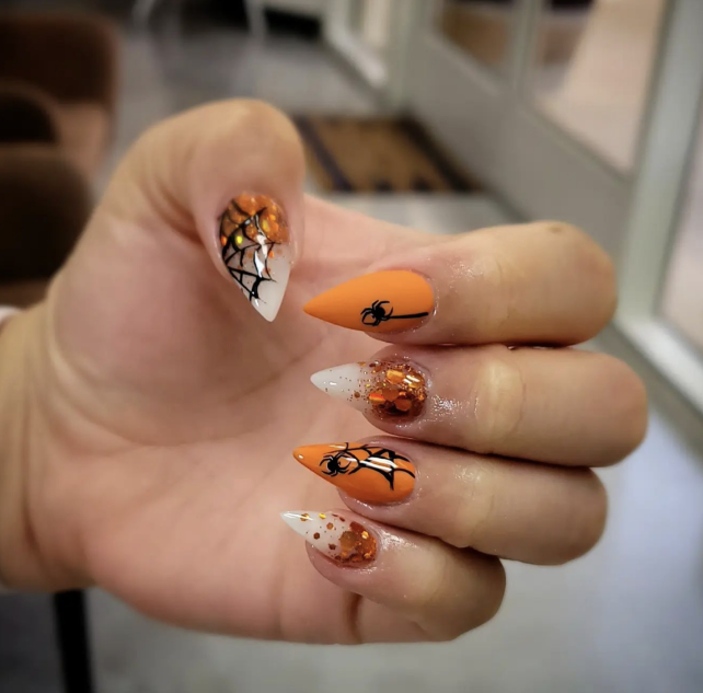 Spooky Halloween Nails With Glitter And Spider Webs