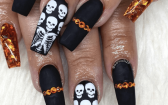 Spooky Matte Black Nails With Skull And Skeleton Designs